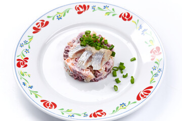 herring salad on the white background