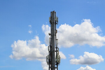 Antenna for communication Behind the blue sky and white clouds