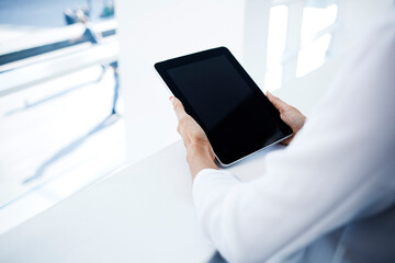  Female is reading electronic book on portable touch pad