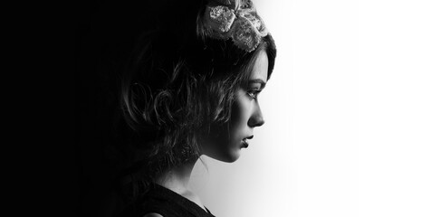 Profile of beautiful young woman side view face isolated on white and black background, panoramic photo