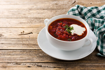 Traditional Ukrainian Russian borsch. Beetroot soup on wooden table copy space