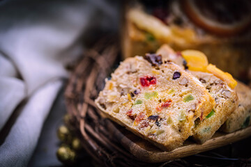 Fresh sliced homemade fruit cake with juicy candied fruits