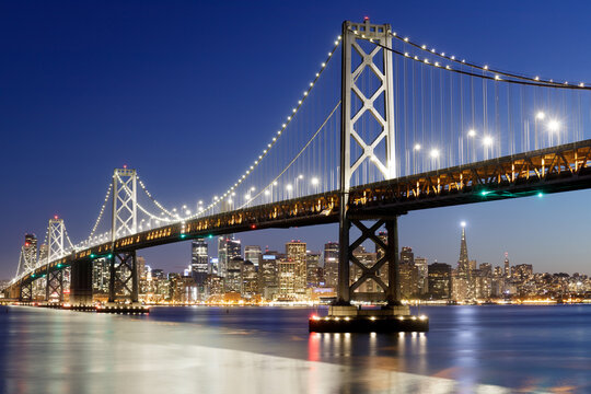 Blue Hour over the Bay Bridge and the city. Yerba Buena Island, San Francisco, California, USA.

