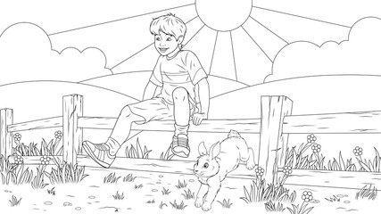 Boy in the summer plays with a rabbit