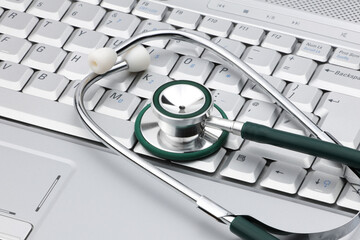 Medical stethoscope on a laptop signifying the relationship of IT and medicine