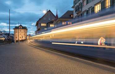 Light trails of a tram in Zurich at the blue hour