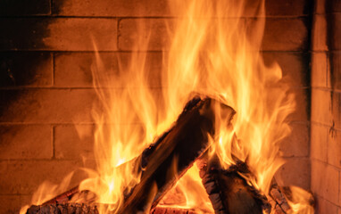 Fire burning in cozy fireplace, christmas, vacation.