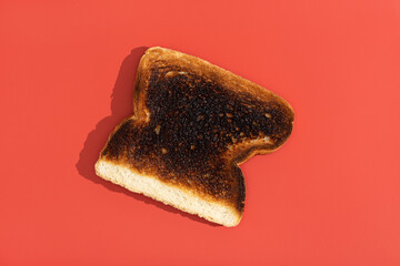Dark Burned Sandwich Bread Isolated on red Background