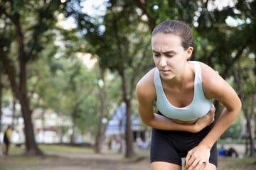 sports woman, fitness woman suffering from stomachache, diarrhea, constipation, food poisoning