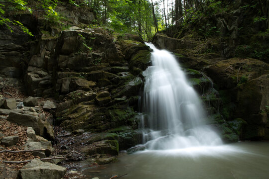 Beautiful waterfall among rocks in forest, Obidza, Malopolskie, Poland.