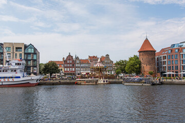 Fototapeta premium Gdansk, Poland - Juny, 2019. Gdansk old town and famous crane, Polish Zuraw. View from Motlawa river. The city also known as Danzig and the city of amber.