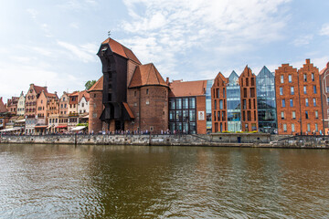 Gdansk, Poland - Juny, 2019. Gdansk old town and famous crane, Polish Zuraw. View from Motlawa river. The city also known as Danzig and the city of amber.