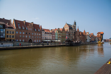 Fototapeta na wymiar Gdansk, Poland - Juny, 2019: Motlawa river with old town architecture background in Gdansk, Poland