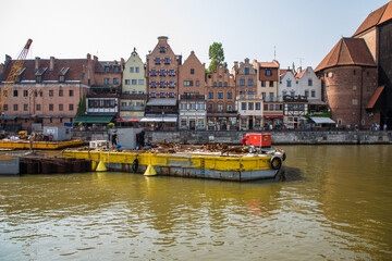 Gdansk, Poland - Juny, 2019: Motlawa river with old town architecture background in Gdansk, Poland