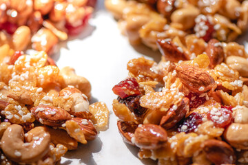 The process of making homemade cereal cookies, Is an easy-to-make food for health lovers,Cashew,Almonds,Corn cereal,raisin,Dried Strawberries,White sesame ,honey,egg white, Selective focus.