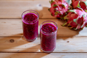 Juice Asian Dragon fruit on the wooden background