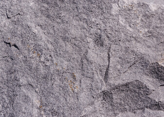texture of a cracked brown stone