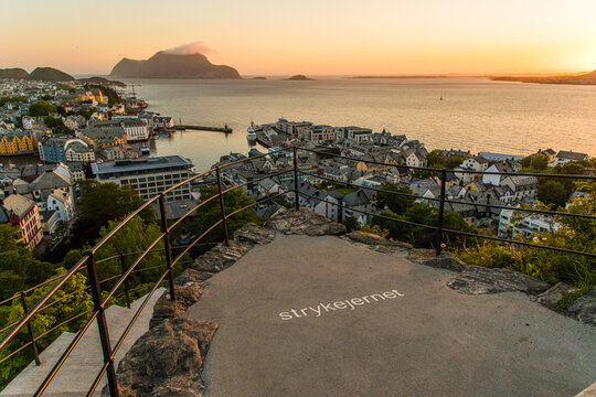 Gdansk, Poland - Juny, 2019: Alesund is a port and tourist city at the entrance to the Geirangerfjord. Cityscape image of Alesund at dawn.