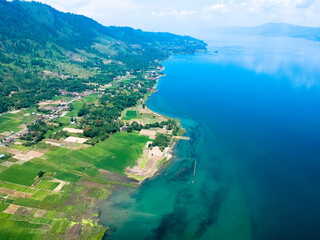 Obraz premium The beautiful aerial view of Lake Toba. Lake Toba is one of the tourist destinations in North Sumatra, Indonesia.