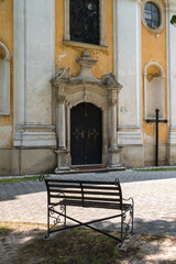 Fototapeta na wymiar Church entrance and a cross Jablonica