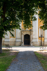 Fototapeta na wymiar Church entrance and a cross Jablonica