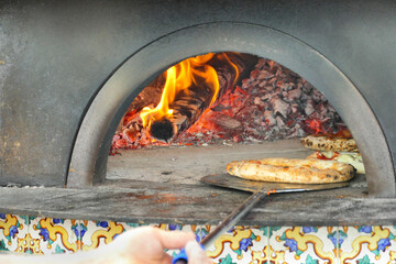 Pizza baked in the traditional wood-burning oven