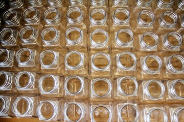 Clean plastic bottles stacked in a factory.