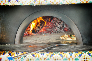 Pizza baked in the traditional wood-burning oven