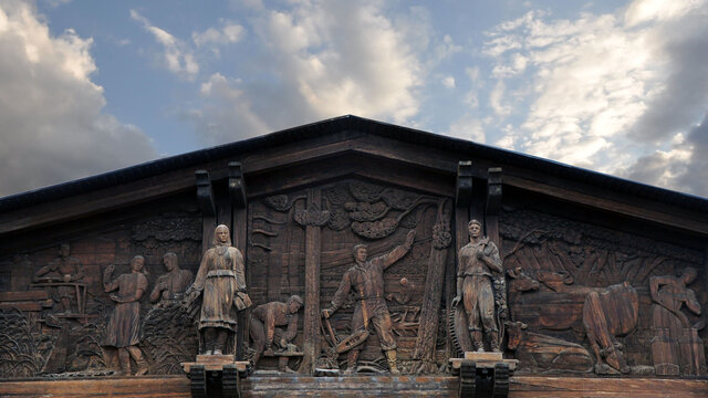 The pediment of the Soviet building depicting the labor successes of the Soviet people