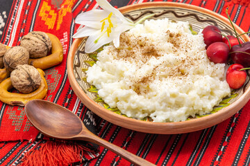 rice pudding, pentecost romanian dish usually served in a clay bowl with various fruits and given to strangers as offerings for the memory of the loved ones that are gone