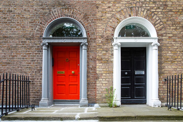 Fototapeta premium Colorful georgian doors in Dublin, Ireland. Historic doors in different colors painted as protest against English King George legal reign over the city of Dublin in Ireland