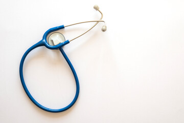 STETHOSCOPE OF BLUE COLOR FORMING THE SILHOUETTE OF AN ANATOMIC HEART