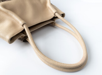 Brown leather women bag on a white background
