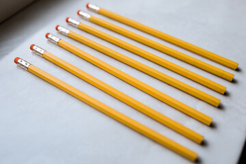 orange pencils on a light background, graphic pencil