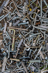 pile of nails, nuts and bolts, and screws. Metal tools assortment. Fasteners fittings