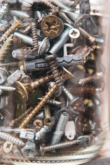 screws, nuts and bolts. Blurry old metal fasteners assortment. Hardware for repair or fixing