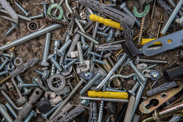close up of nails and bolts. Messy industrial background for Fathers Day. Assorted metalware flat lay