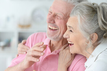 Obraz na płótnie Canvas Close up portrait of happy senior couple at home