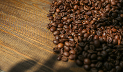 roasted coffee beans on wooden background