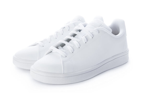 Pair of stylish sneakers isolated on white background. White casual shoes