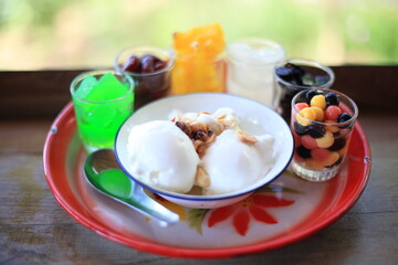 Coconut ice cream with fresh toppings.