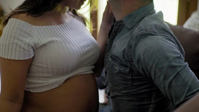 MS TD Pregnant couple kissing / Milan, Italy