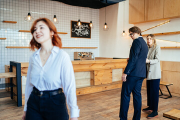 Two coworkers Staring and Gossiping About Their Female Colleague