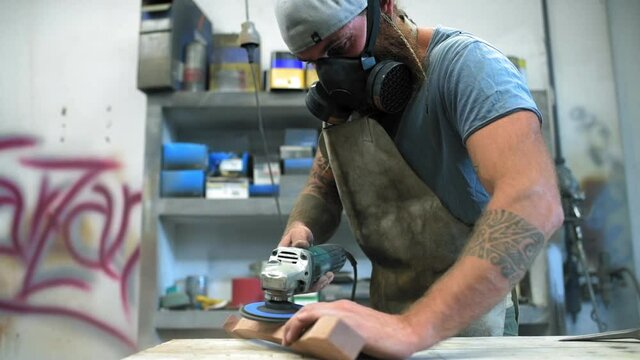 MS Carpenter working with grinder in workshop / Mariano Comense, Como, Italy