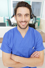 male worker on the reception of a hospital