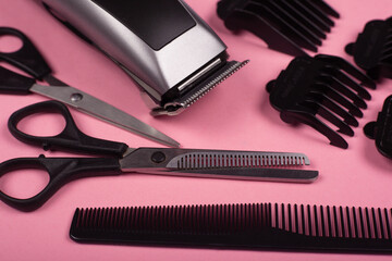haircut accessories, barber tools on a pink background