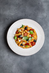 Pasta fusilli with cherry tomatoes, basil and olives. Homemade pasta 