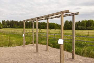 Obraz premium View of horizontal bars for outdoor exercises on green grass lawn background. Health concept. Sweden. Europe.