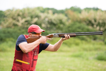 Man shooting on an outdoor shooting range