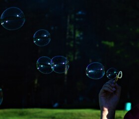soap bubbles in the hands of the girl